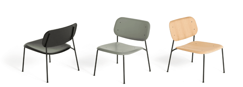 Three HAY Soft Edge 100 chairs in black, green, and wood with steel legs.