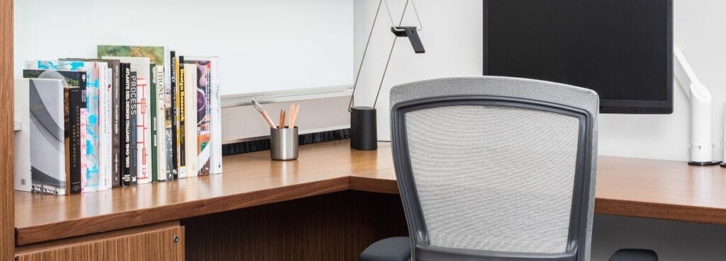 Life® Work Chair by Knoll – Designed by Formway, gray mesh ergonomic office chair at a desk.