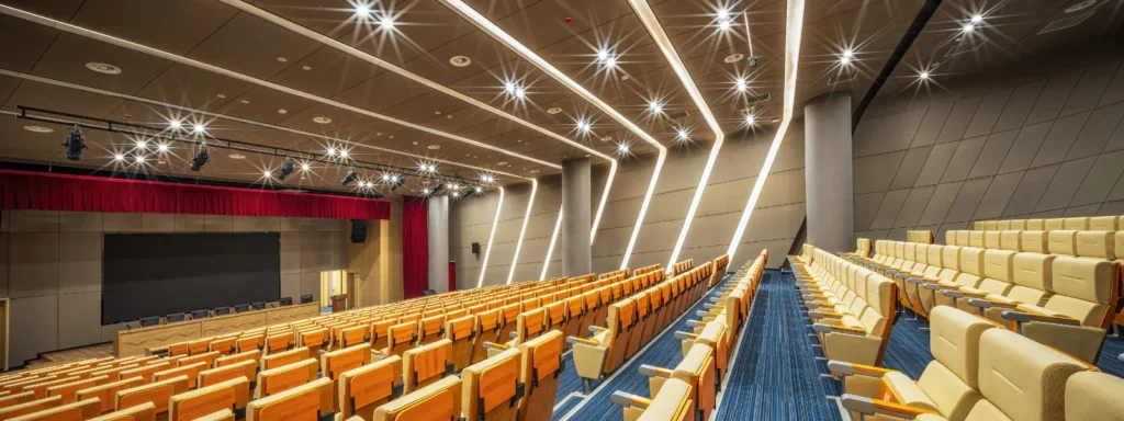 Modern lecture hall furniture and design. Rows of empty seats in a university auditorium.