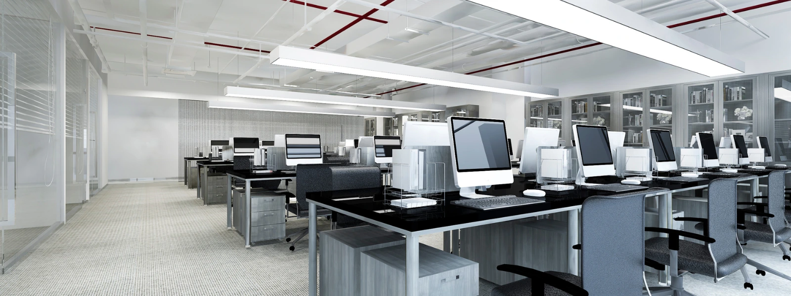 Modern office space featuring sustainable office furniture and computer workstations.