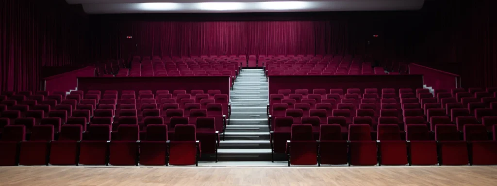 Empty amphitheater with red velvet seats and curtains, Cyprus furniture.