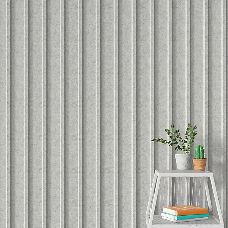 Light grey 3D U-Channel Acoustic Panel with felt texture, featuring vertical fluted lines behind a small plant and shelf.
