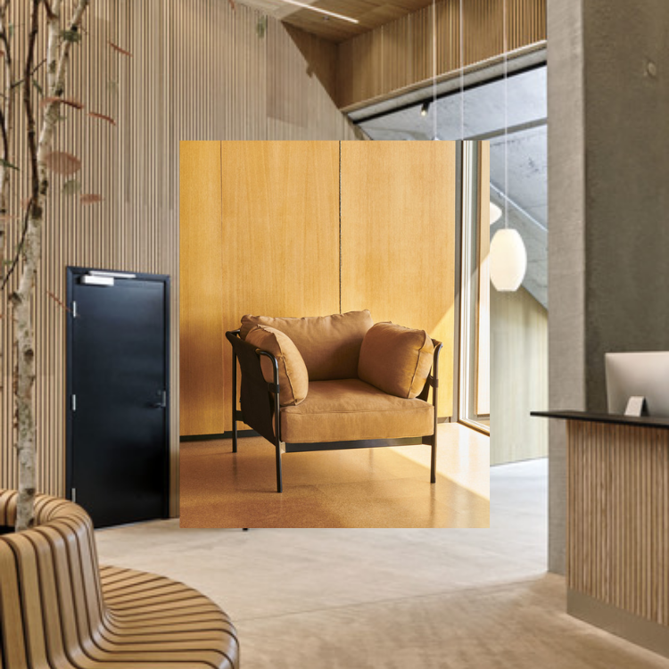 CAN 1 Seater armchair with a soft tan upholstered seat and a sleek black frame in a modern interior setting.