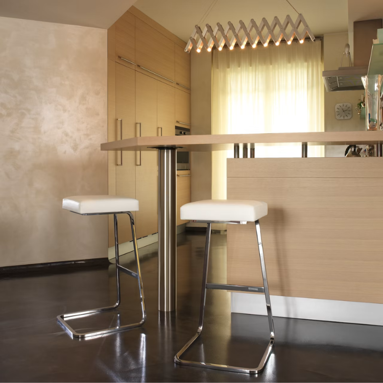 Four Seasons Barstool with white upholstered seat and chrome bent-steel frame in a modern kitchen setting.
