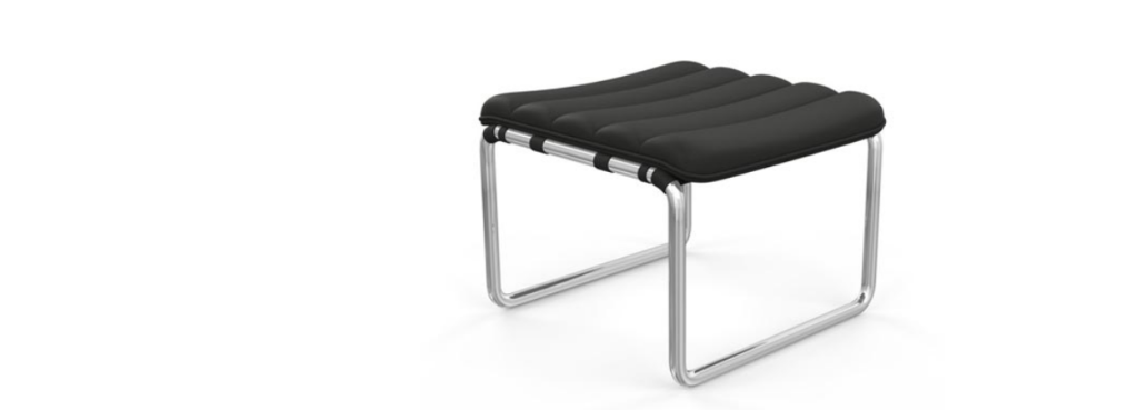 Close-up view of the MR Stool showing its bold black tufted cushion resting on a curved reflective metal pipe frame.