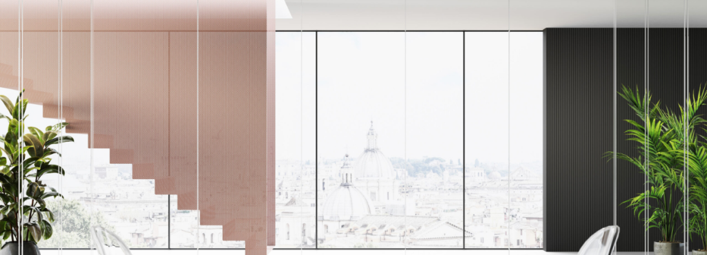 Mood M2 glass partitions organize a modern room featuring a soft blush staircase and an integrated black feature wall.