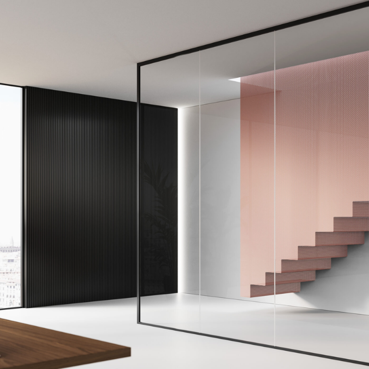 Mood MM glass partition featuring transparent panels with minimal black framing in a modern architectural interior.