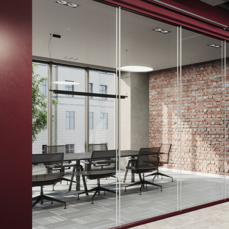 Pure Fire-Resistant System featuring slim profiles and clear glass partitions in a modern office meeting room.