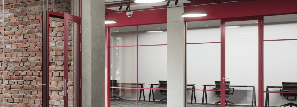 Ultra Silence Fire-Resistant System frames installed within a modern office featuring exposed brick and open workstations.
