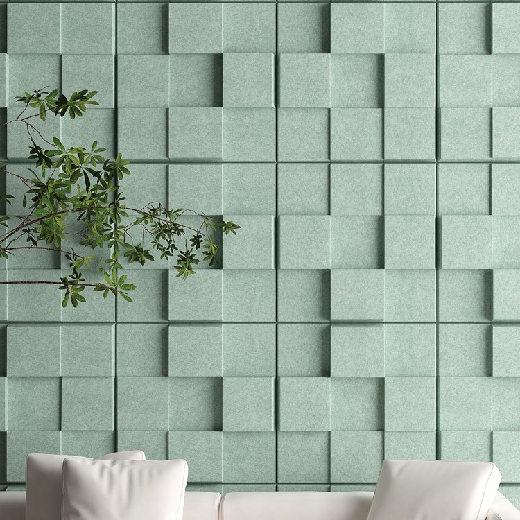 Urban Lumen acoustic panels featuring sage green felt cube blocks creating a textured, dimensionally layered wall surface.