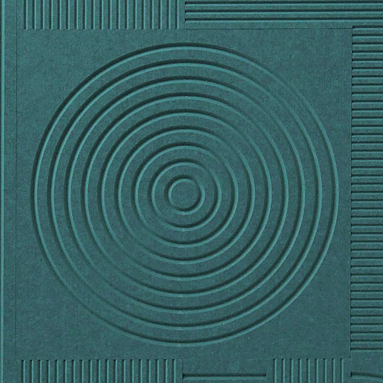 Close-up of a V-Flute Carved Acoustic Panel in matte green PET felt showcasing recessed circular and linear grooves.