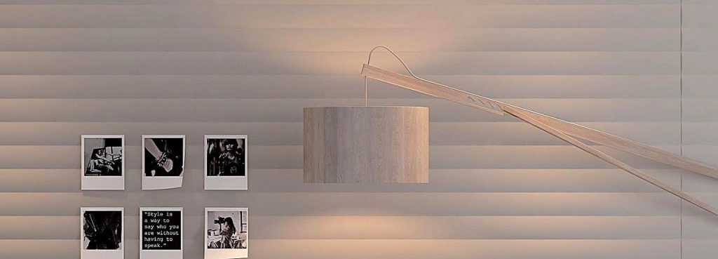 Valen Wave Horizontal Acoustic Panel featuring soft wavy PET felt slats in a neutral tone with a modern wall lamp.