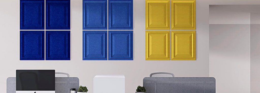 Wall Guard acoustic panels with classic raised-and-fielded wainscot design in vibrant blue and yellow PET felt.