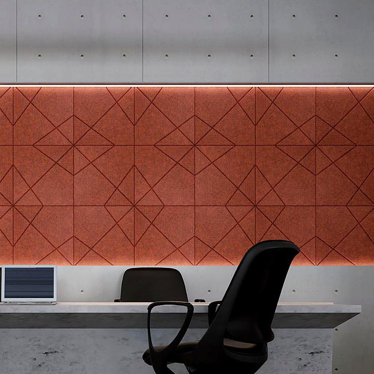 Terracotta X Form felt panels featuring a deep embossed diamond pattern, creating a textured feature wall in an office.