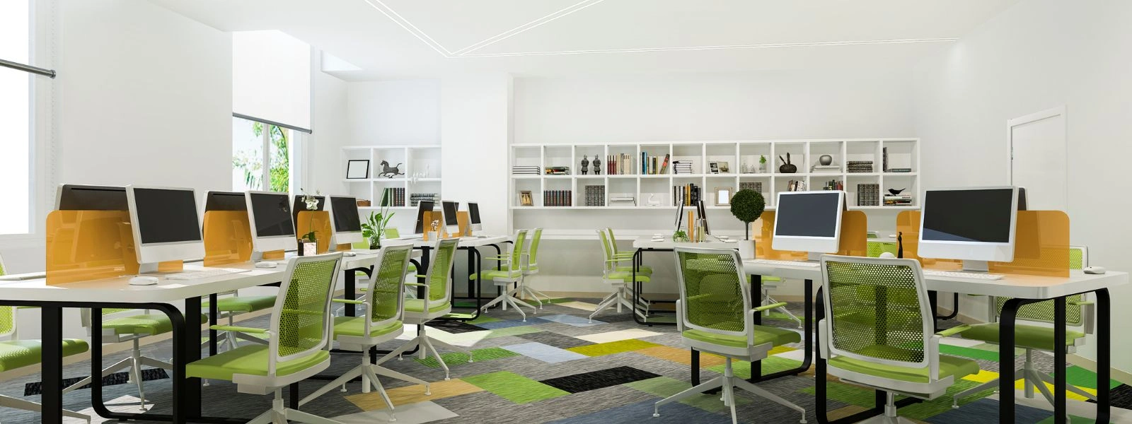Modern open-plan office with activity-based workstations, white desks, green chairs, and colorful geometric carpet tiles.