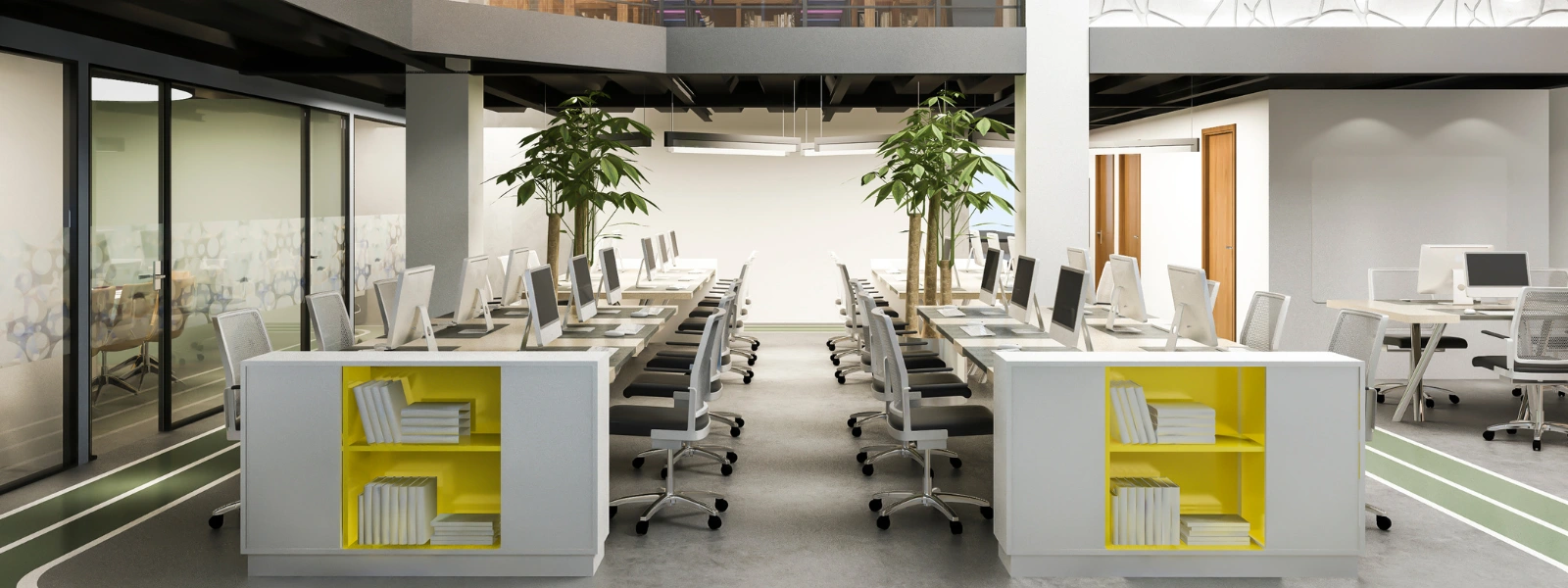 Modern open-plan office space featuring organized rows of computer workstations and bright yellow storage units.